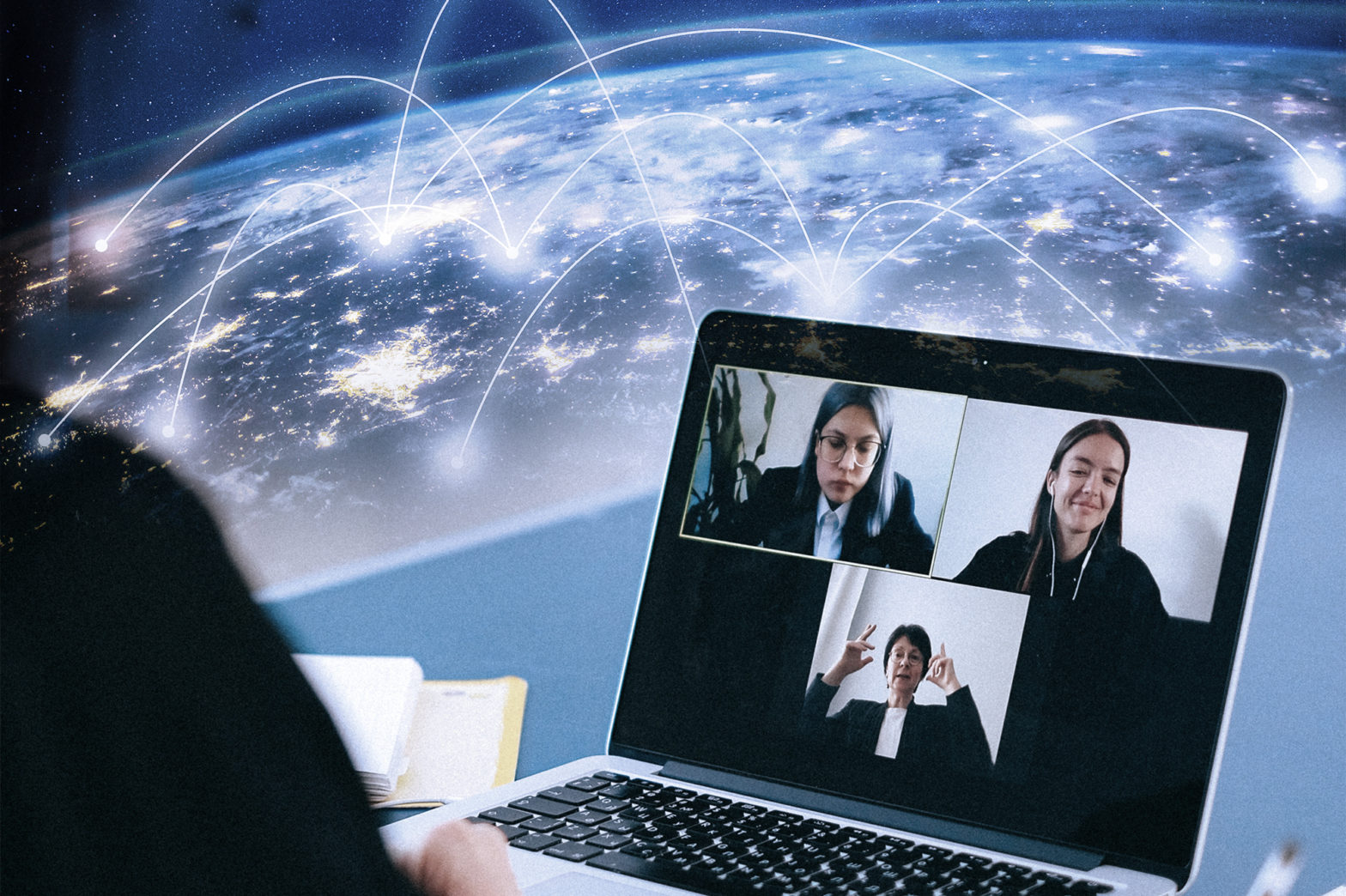 Three colleagues connecting through a video meeting over connecting lights across a globe.
