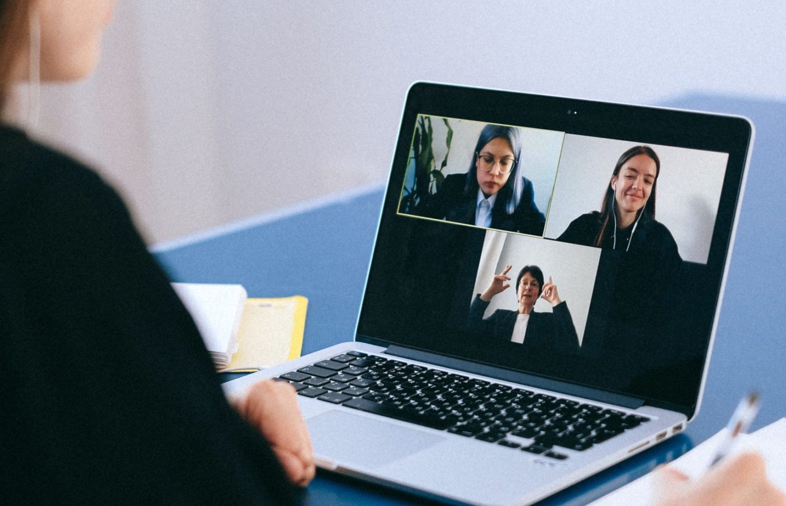 Three women on a laptop screen talking to each other
